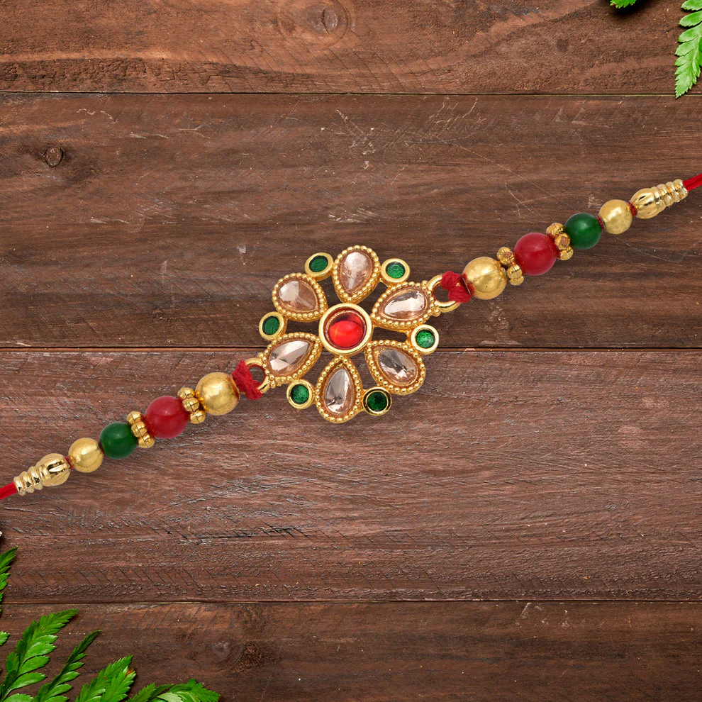 [KBS-1054] Floral Kundan Rakhi with Red-Green Beads and Golden Finish