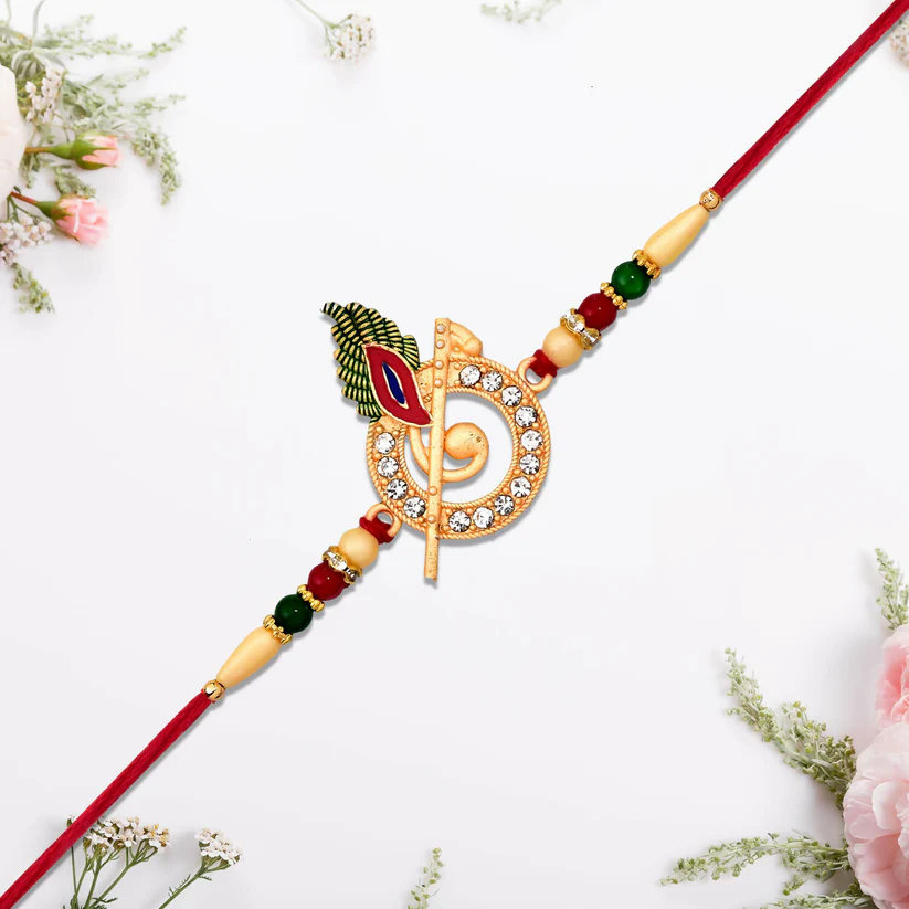 [KBS-1062] Krishna Flute Rakhi with Stone Studded Peacock Feather Design